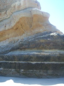 Striations in cliff wall face next to Flat Rock