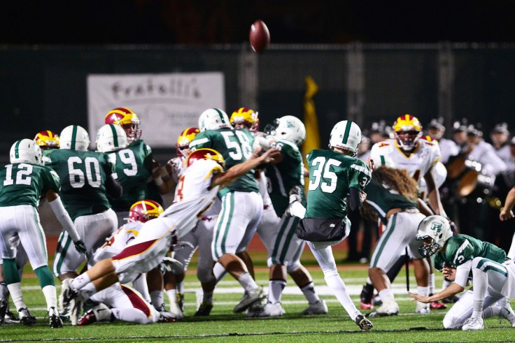 That's #18 flying in from the corner in an attempt to block the kick