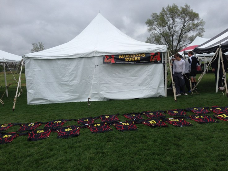Jerseys lined up outside the Mustang's tent for pre-game handouts.